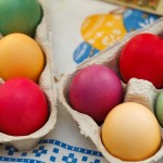 Cartons of colorfully dyed eggs