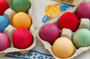 Cartons of colorfully dyed eggs
