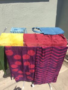 Some of the natural dye projects from the fiber arts retreat last year. Indigo, cochineal, onion skin, and madder dye. Indigo over cochineal shibori resist on silk zig-zag pattern, and clamped resists on dot pattern.